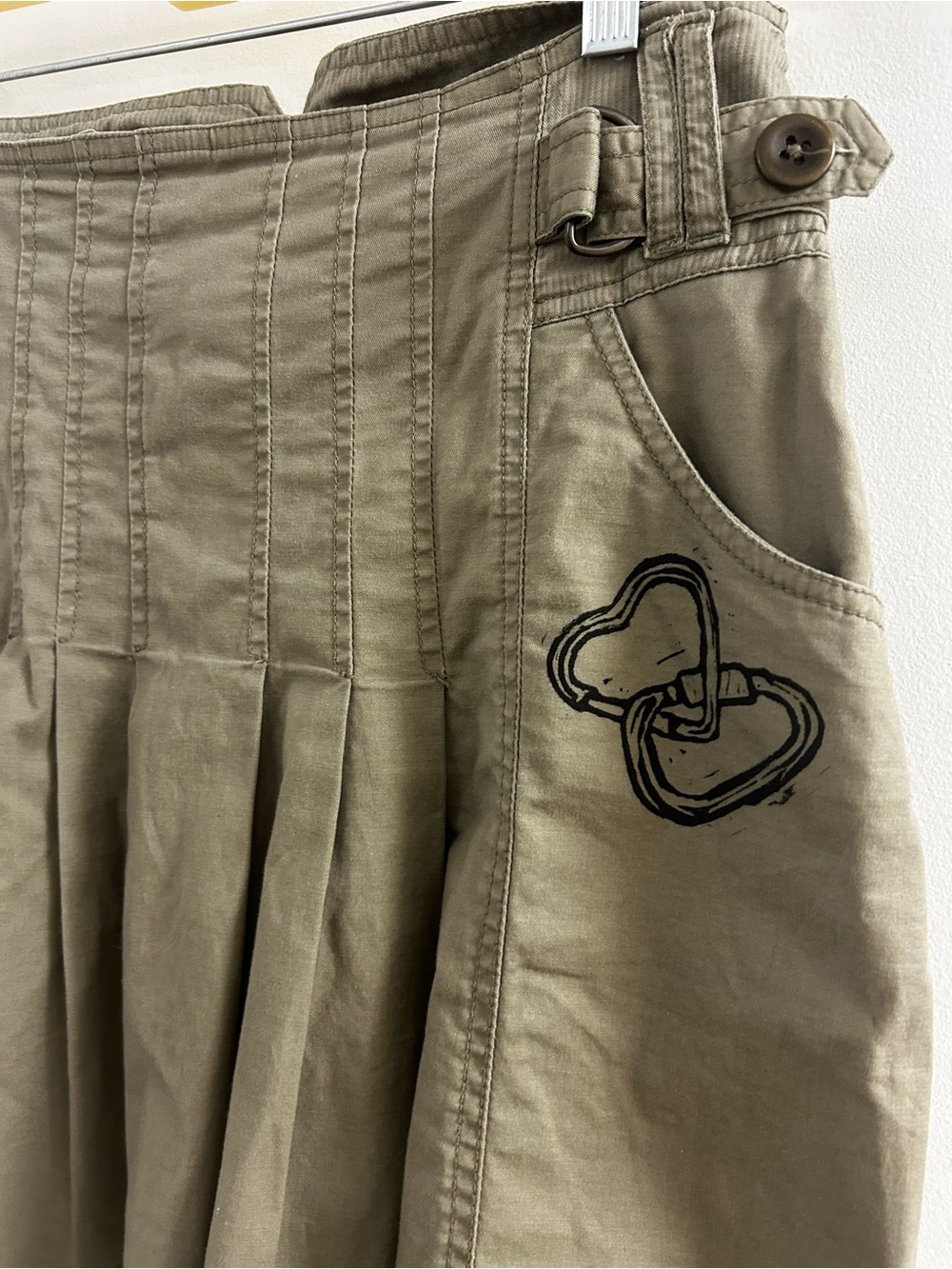 Olive Pleated Skirt with handprinted lyno design
